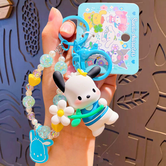 Sanrio - Pochacco - Sleutelhanger – Tranquil Floral Serie – Schattig Sleutelaccessoire met Parelmoer Kralen – 7 cm – Perfect voor Tassen, Autosleutels & Cadeaus voor Kawaii Liefhebbers