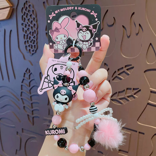Sanrio – Kuromi Telefoonkoord / Phone Strap – Officieel Gelicentieerd – Zwartroze Serie – Met Insteekkaart voor Je Telefoon – Luxe Kawaii Accessoire met Parelstrik, Pluizenbol & Kralen – Ook als Sleutelhanger of Cadeau