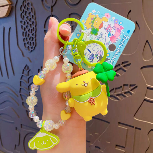 Sanrio - Pompompurin - Sleutelhanger – Tranquil Floral Serie – Schattig Sleutelaccessoire met Kralenarmband – 7 cm – Perfect voor Tassen, Autosleutels & Cadeaus voor Kawaii Liefhebbers