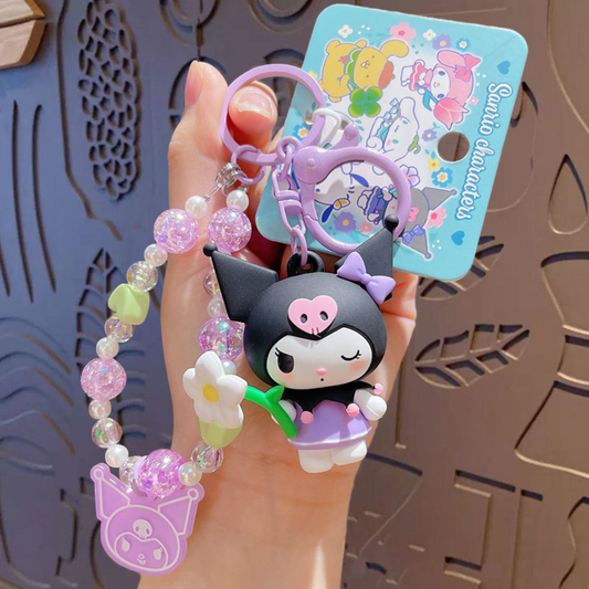 Sanrio - Kuromi - Sleutelhanger – Tranquil Floral Serie – Schattig Sleutelaccessoire met Parelmoer Kralen – 7 cm – Perfect voor Tassen, Autosleutels & Cadeaus voor Kawaii Liefhebbers